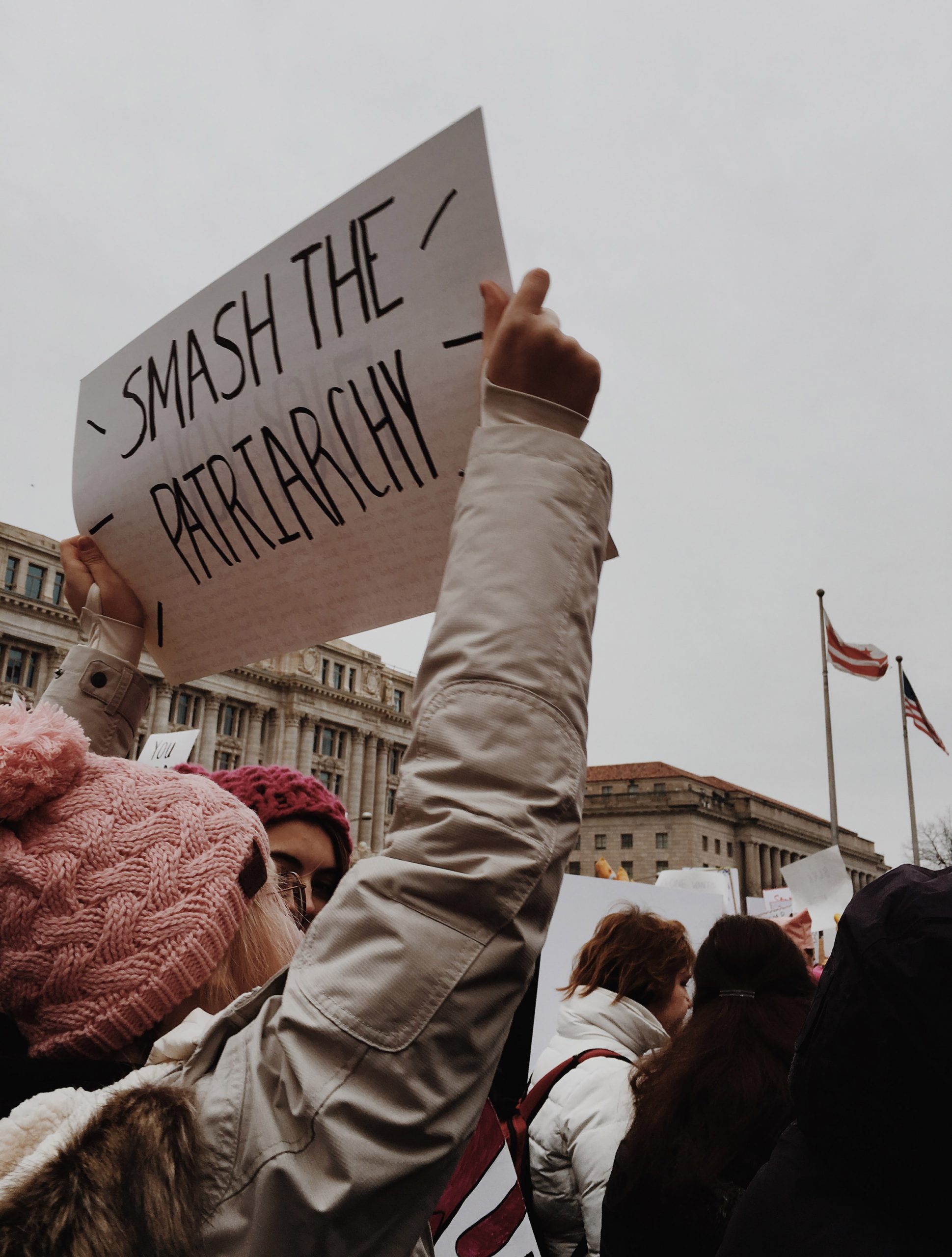 woman holding sign that reads 'Smash the patriarchy' (link to file)