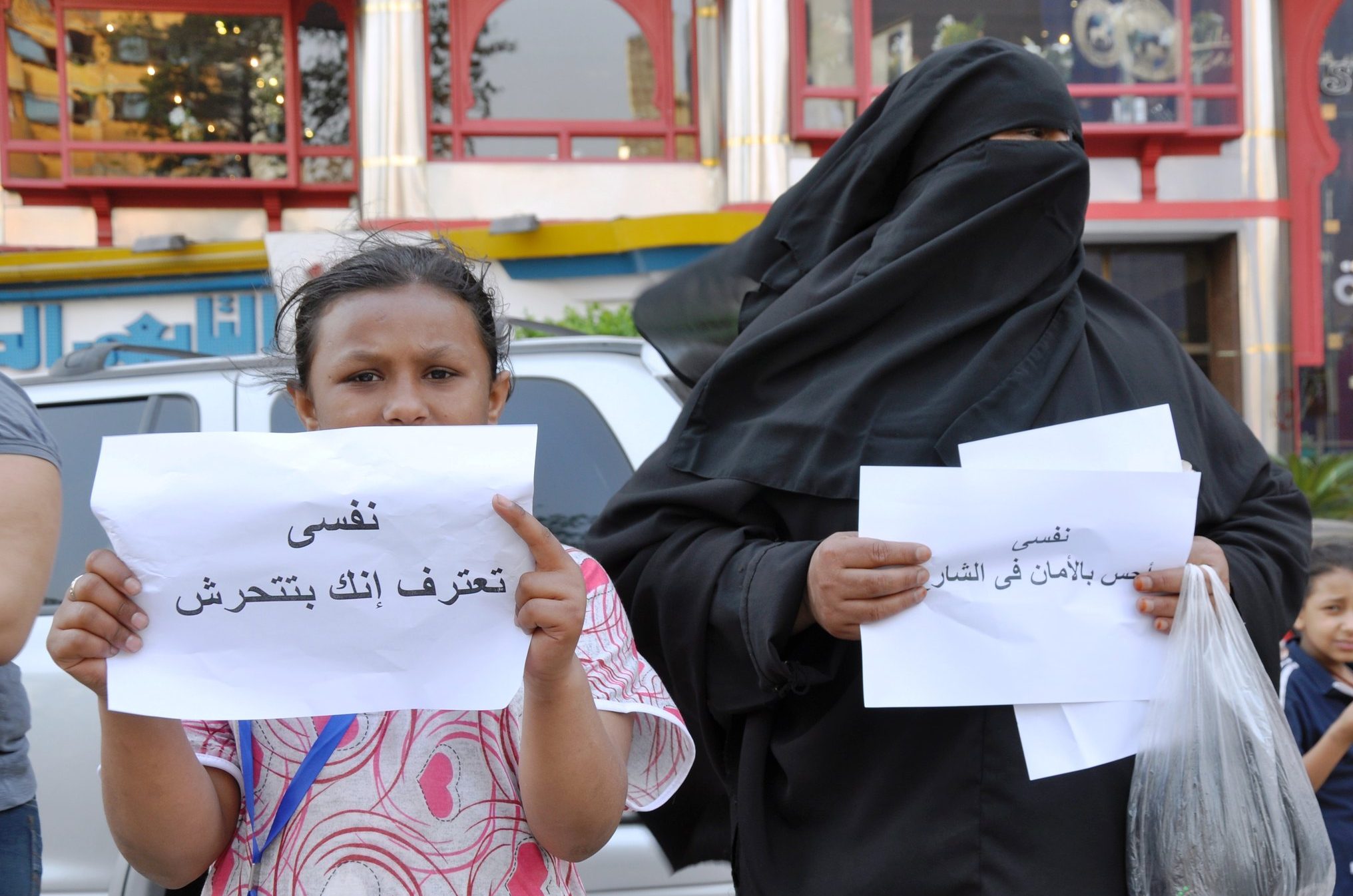 girl and woman with gender equality signs (link to file)