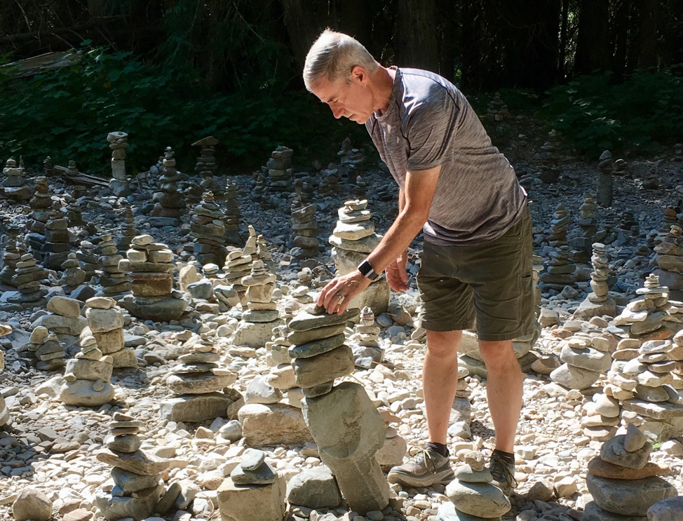 John building cairns.