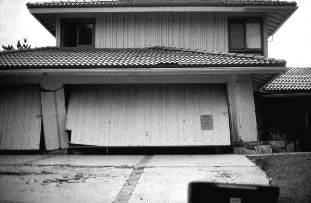 Soft-story failure to three-car garage during 1971 Sylmar, California, Earthquake