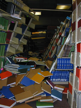 Bookcases collapsed during 2001 Nisqually Earthquake, showing the necessity of attaching heavy furniture to wall, especially furniture that might land on sleeping children.