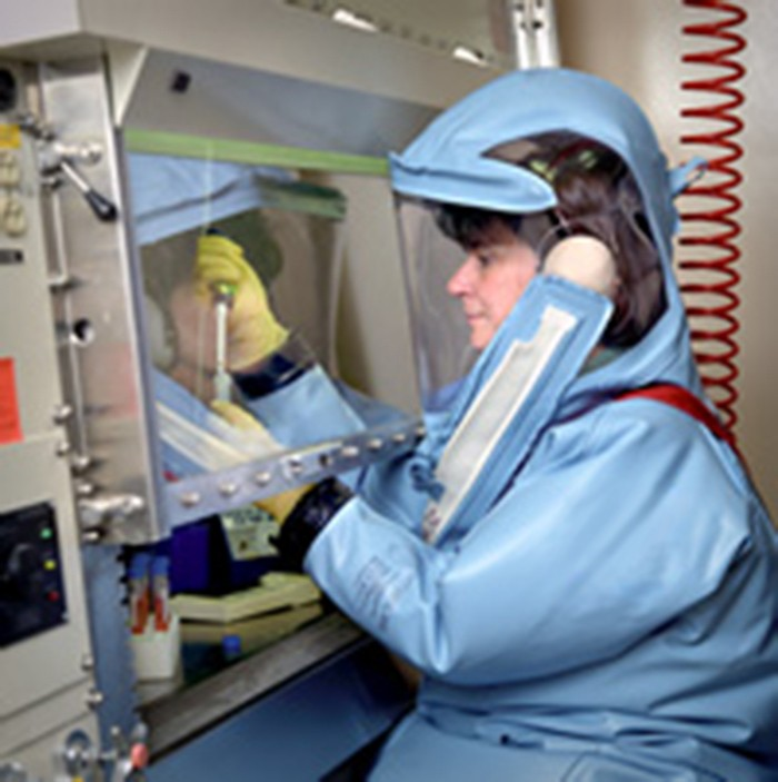A protective suit like this one is an additional precaution for those who work in BSL-4 laboratories. This suit has its own air supply and maintains a positive pressure relative to the outside, so that if a leak occurs, air will flow out of the suit, not into it from the laboratory.